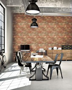 an industrial style dining room with brick walls