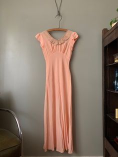 "1940s Pandora Peach Silk Nightgown in overall excellent condition with just one very faint spot (hardly noticeable, please see last photo). Measured flat: Pit to pit 16\" Waist 12.5\" - stretches to 14.5\" Hips 19\" - stretches to 20.5\" Length 53\" PLEASE READ! *MEASUREMENTS* All items are measured while laying flat and unstretched. For clothing: chest, waist, hip and thigh measurements should be multiplied by two. All measurements are in inches. *VINTAGE CONDITION* Vintage goods may show sign Night Slip, Nightgown Vintage, 1920 Dress, Sleeping Dress, Silk Nightgown, Pink Gowns, Women's Nightgowns, Sleep Dress, Nightgowns