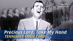 a man in a suit singing into a microphone with the words precious lord, take my hand tennessee entire ford