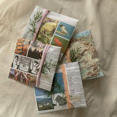 many different pictures are placed on top of an open book with some paper attached to it