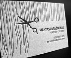 a business card with scissors on it and the words mantas - paradisks