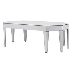 a mirrored table with three legs on it