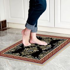 a person standing on top of a rug