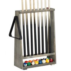 a rack with pool balls and cues in it on a white background for display