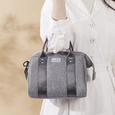 Our chic, lightweight, Multi-functional Diaper Bag is perfect as a hospital bag for essentials, traveling, and an all around stylish feel for all genders. Its water-resistant Polyester fabric is fundamental for on-the-go parents. Lightweight and versatile for short trips. Options to Carry: Handbag, Crossbody, Shoulder Bag. Spacious organization with big zipper and internal compartments. Durable, waterproof Polyester exterior, easy-to-clean interior, stroller-friendly design. Size 20 x 30 x 15 CM Casual Travel Lunch Bag With Removable Pouch, Functional Large Capacity Lunch Bag For On-the-go, Casual Backpack Lunch Bag For Travel, Functional Portable Lunch Bag For Travel, Portable Functional Lunch Bag For Travel, Casual Backpack Style Lunch Bag For Travel, Travel Tote Lunch Bag With Zipper Closure, Large Capacity Casual Lunch Bag For Travel, Casual Travel Lunch Bag With Zipper Closure