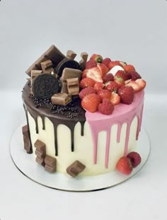 a cake with chocolate and strawberries on top