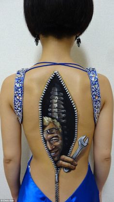 the back of a woman's body with an image of a man holding a wrench