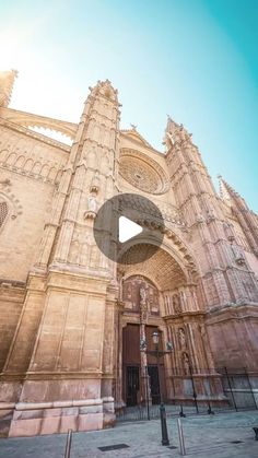 an old church with the sun shining on it