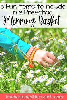 a child's hand in the grass with daisies and text overlay that reads 5 fun items to include in a preschool morning basket