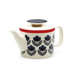 a white tea pot with blue flowers on the front and red trim around the top