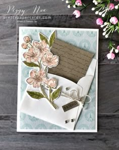 a close up of a card with flowers on it