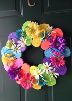 a wreath made out of flip flops and flowers