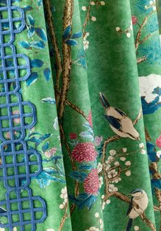 curtains with birds and flowers on them are lined up in rows, one is green