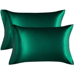 two green satin pillows on a white background