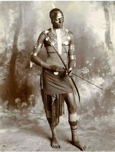 an old photo of a native american man in traditional garb and headdress