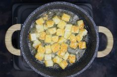 a pan filled with food on top of a stove