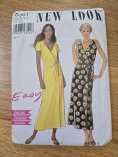 a woman's dress sewing pattern on a wooden table