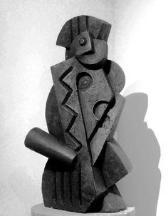 a black and white photo of a sculpture with a bird on it's back