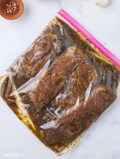 the meat is wrapped in plastic and ready to be put into the freezer bag