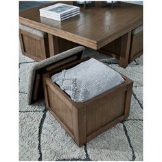 a wooden coffee table with storage underneath it