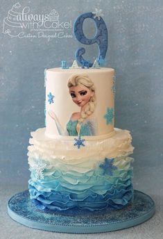 a frozen princess birthday cake with blue icing