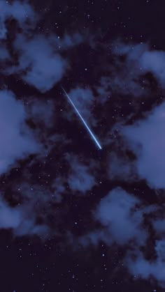 an airplane flying through the night sky with clouds and stars in the foreground,