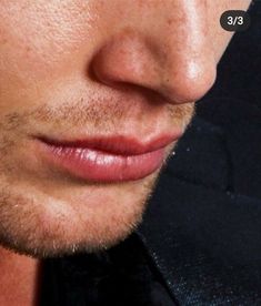 a close up of a man's face and nose