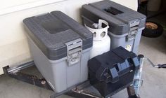 two coolers sitting on the back of a trailer