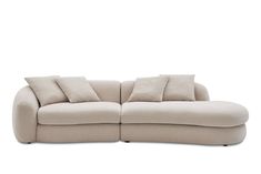 a white couch with two pillows on it's back and one arm facing the camera