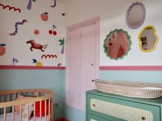 a baby's room decorated in pastel colors