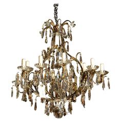 a large chandelier with many lights hanging from it's center and sides