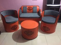 an orange and gray harley davidson themed living room set with matching chairs and ottomans