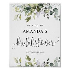 the bridal shower sign with greenery is shown in white and green, as well as