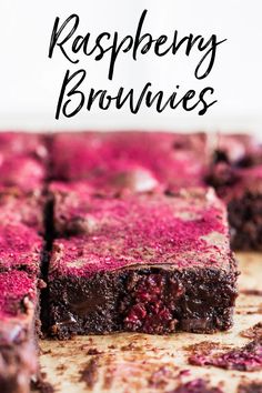 raspberry brownies cut into squares on a cutting board with text overlay