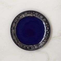 Statement-making salad plate suits special occasions with its glossy cobalt blue finish. Accented with a reactive glaze around the rim, the plate is marked by striking tonal variations and crackles in the glaze produced during firing. Part of the Cordelia cobalt blue dinnerware collection. CB2 exclusive.       Stoneware with glossy cobalt blue finish      Reactive glaze on rim      Each piece will vary in glaze coloring and tone      Microwave-safe      Hand-wash on Making Salad, Blue Salad, Grey Dinnerware, Black Flatware, Black Dinnerware, Grey Mugs, Pink Napkins, Bone China Dinnerware, Blue Dinnerware