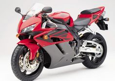 a red and black motorcycle is shown on a white background with no people around it