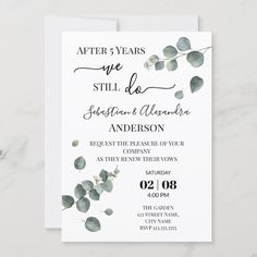 an elegant wedding card with eucalyptus leaves