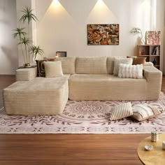 a living room filled with lots of furniture on top of a hard wood floored floor