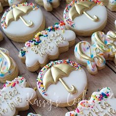 decorated cookies with umbrellas and words on them