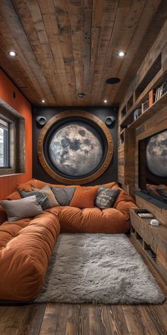 a living room filled with lots of furniture and a large circular mirror on the wall