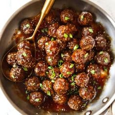 meatballs with sauce and parsley in a pan