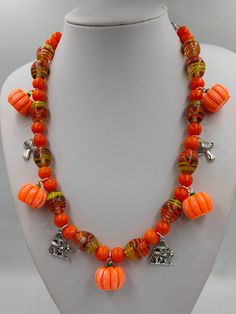 Alsmost Halloween: Pumpkin-time.  A one-of-a-kind  necklace withe beautiful glass beads and cute Pumpkins, Combined with a few mushrooms. The perfect autumn look. 1970s Mens Fashion, Barbie Halloween Costume, Cute Pumpkins, Pumpkin Necklace, Barbie Halloween, Autumn Look, Cute Pumpkin, Orange Slices, Handmade Necklace