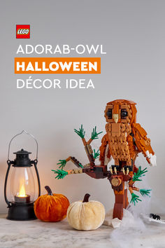 the lego adorab - owl halloween decor idea is displayed with pumpkins and candles