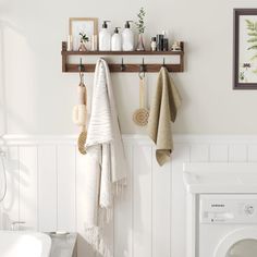 a bathroom with towels hanging on the wall