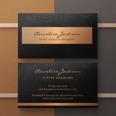 two black and gold business cards sitting on top of each other, one with a name tag