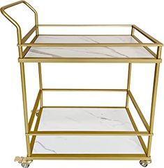 a gold serving cart with marble top and handles, on casteors for easy access