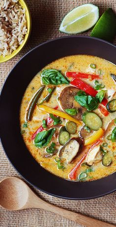 a bowl of soup with vegetables and rice