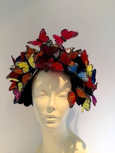 NYC Fascinator- Derby Hat -Monarch Headband- Butterfly Headpiece- Hair Accessory- Mad Hatter- Insect Headband Hi. This butterfly headband/fascinator is made with multi color feather butterflies that are perched on a 5 black roses. The piece is about 7 inches high by 7 inches wide. Each butterfly is hand glued (wing by wing) in the back for extra support and makes it more durable than most butterfly headpieces. The fascinator is on a 1 inch matching covered headband that is adjustable to fit any Butterfly Headdress, Butterfly Headpiece, Butterfly Headband, Floral Headdress, Headband Fascinator, Derby Fascinator, Tea Party Hats, Derby Hat, Church Hats