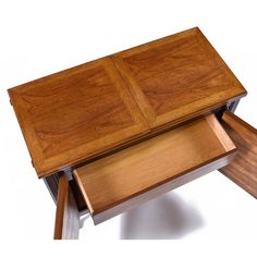 a wooden table with two open drawers on it's sides and one closed drawer at the top