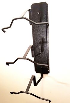 a metal object with two black handles on it